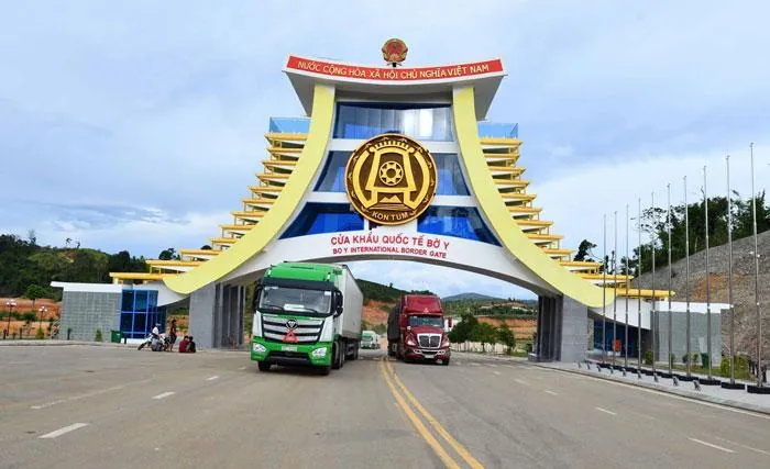 Bo Y International Border Gate arch with trucks passing